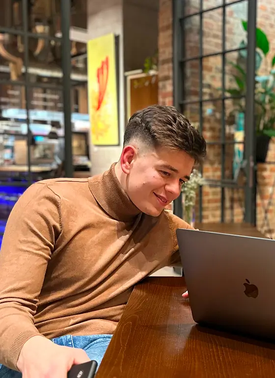 Daniel Zielinski working on a laptop